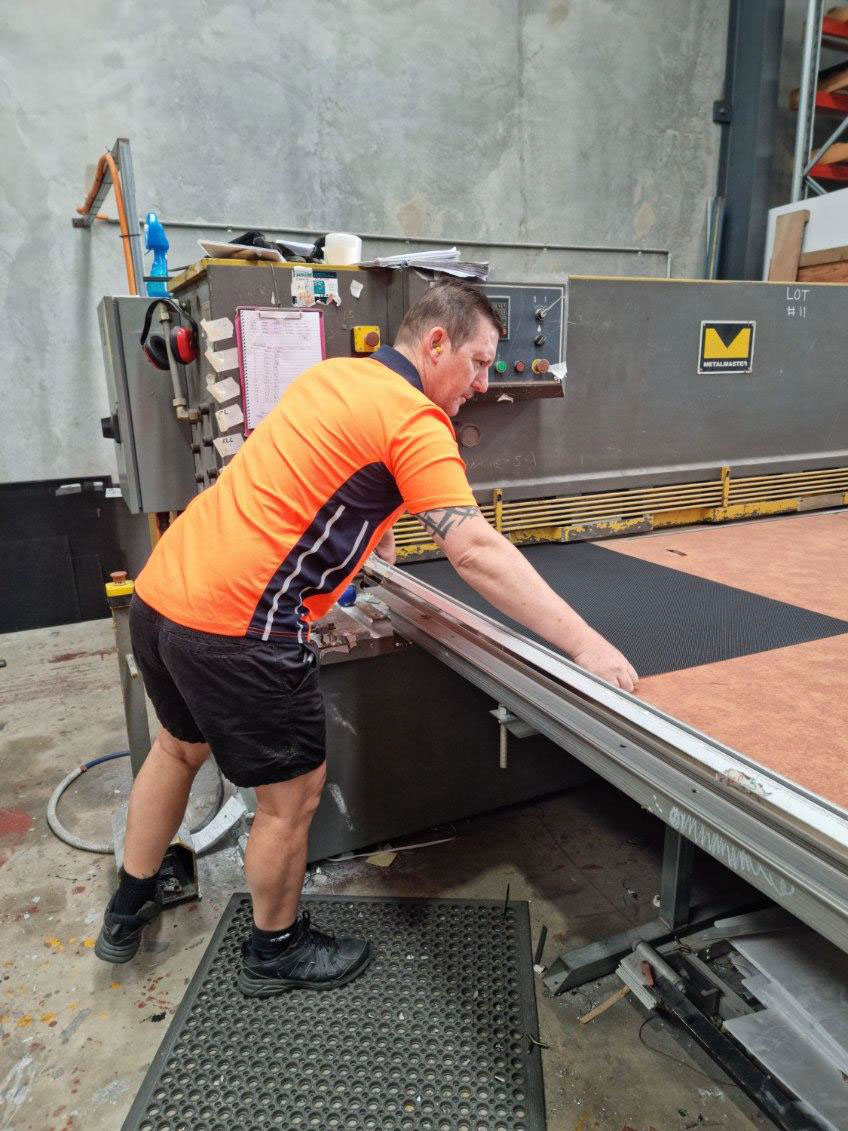 Crimsafe stainless steel mesh being cut to size for a security screen