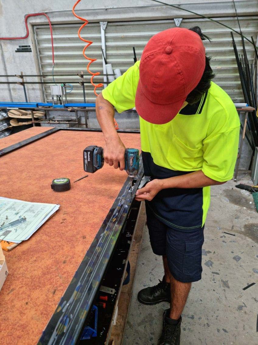 Austral triple-point lock being installed into a Securelux security door