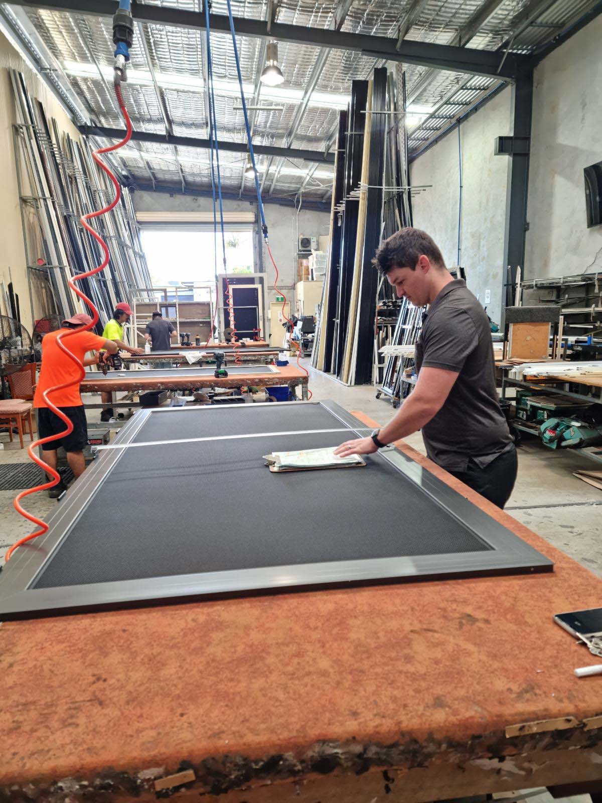 Completed Securelux security screen undergoing final quality control inspection