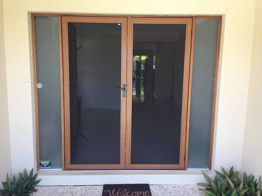 Crimsafe hinged door with woodgrain finish
