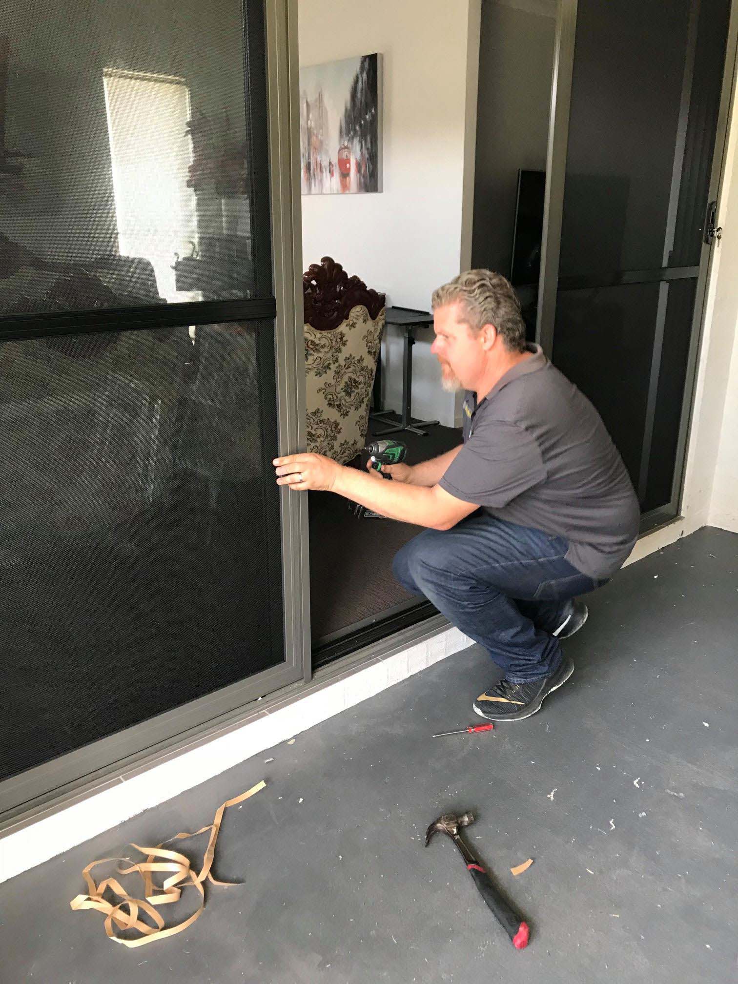 Securelux screen being fitted into a window opening
