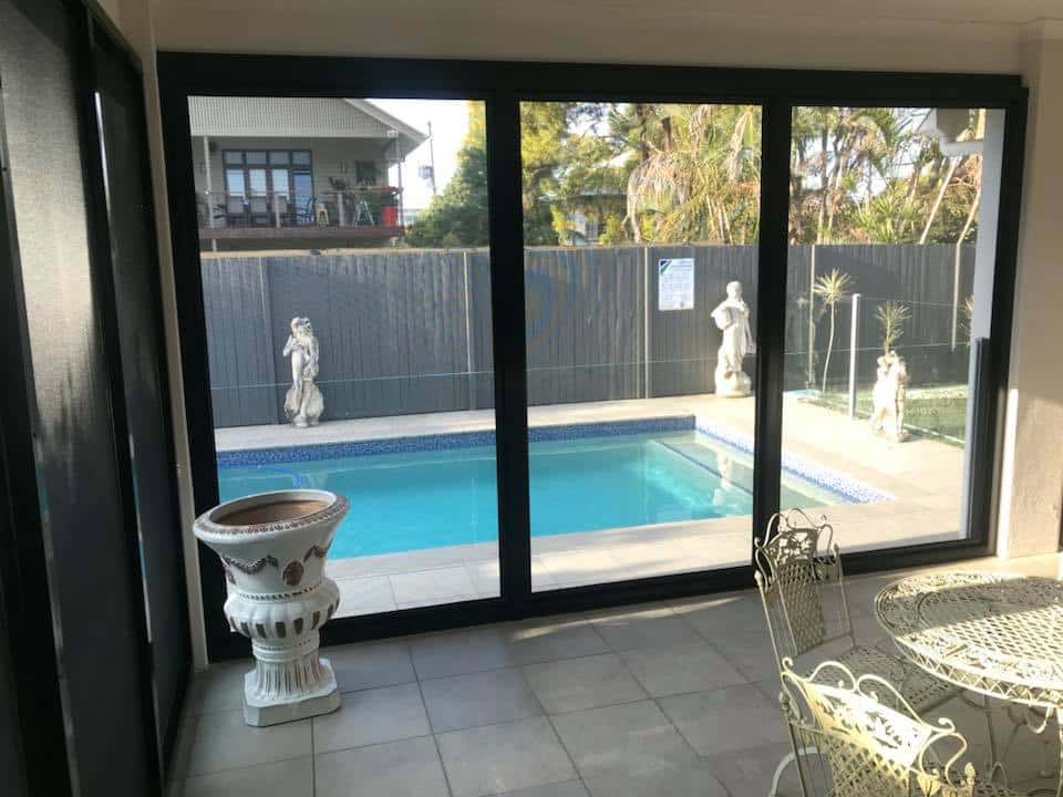 Interior view of a fly-screened patio enclosure installation by Securelux